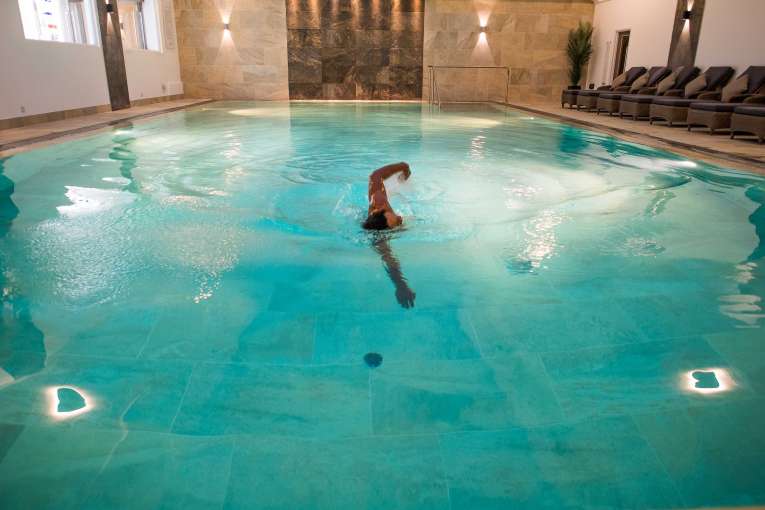 Male swimming in pool