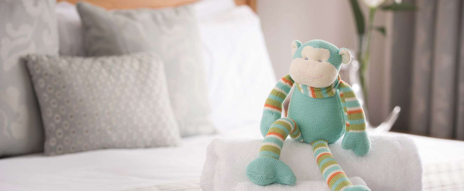 Saunton Sands Hotel Accommodation Bedroom Cuddly Monkey Childs Soft Toy on Bed