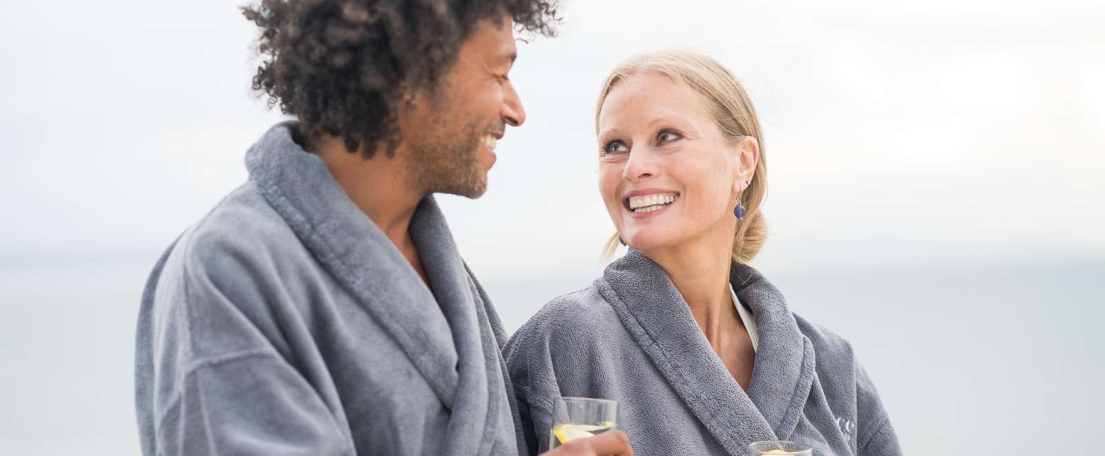 Couple on a spa break looking at each other 
