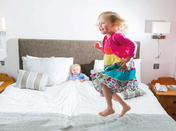 Saunton Sands Hotel Accommodation Child Jumping on Bed