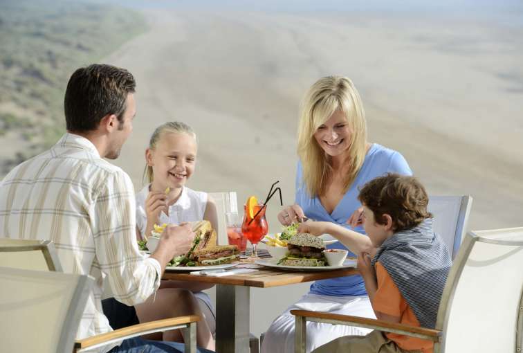 Saunton Sands Hotel Family Eating Lunch on Outdoor Terrace Overlooking Saunton Beach