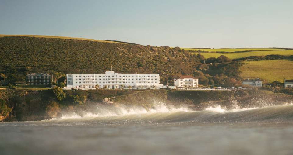 Saunton Sands Hotel Exterior View from Sea with Crashing Wave