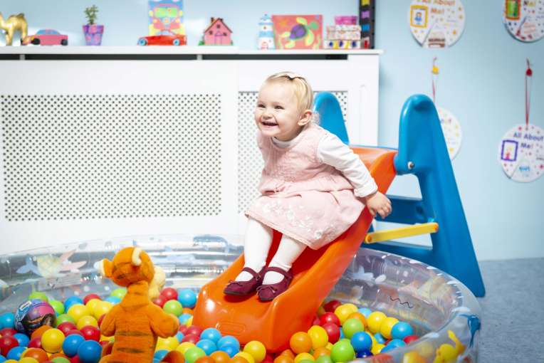 Saunton Sands Hotel Happy Girl on Ballpit Slide in Childrens Play Room