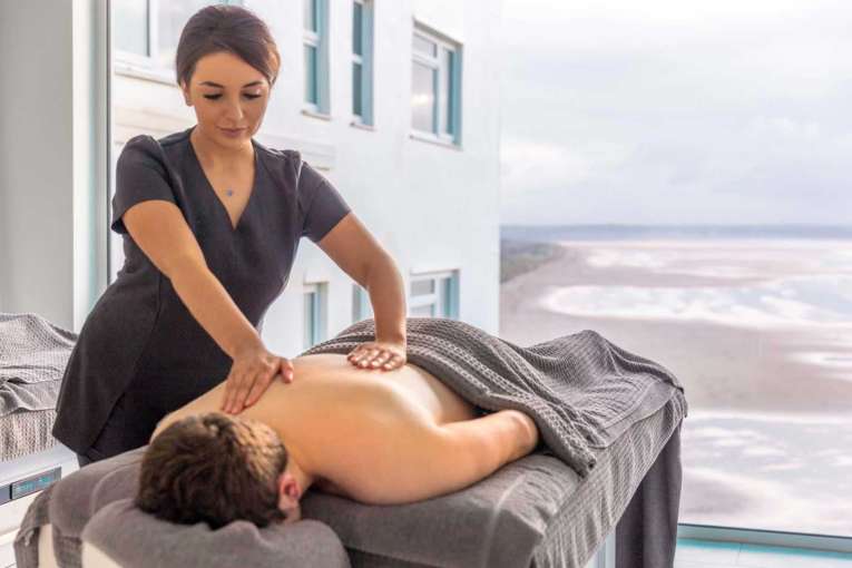 Man having a massage in double treatment room