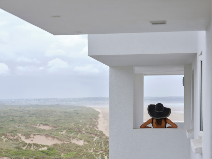Lady on blacony at saunton sands 