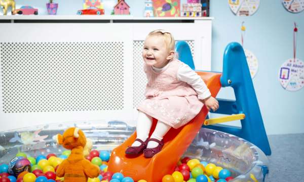 Saunton Sands Hotel Happy Girl on Ballpit Slide in Childrens Play Room