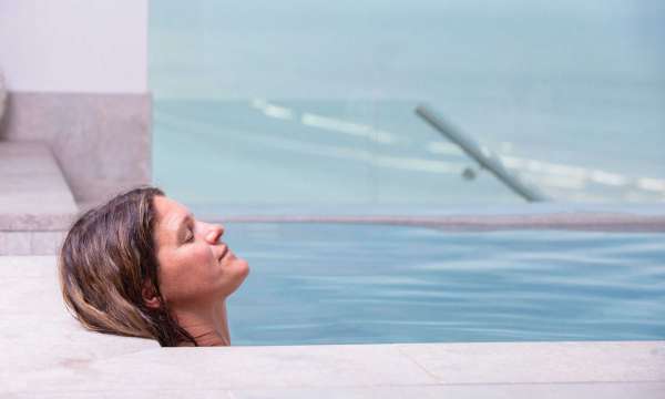 Woman relaxing in vitality pool