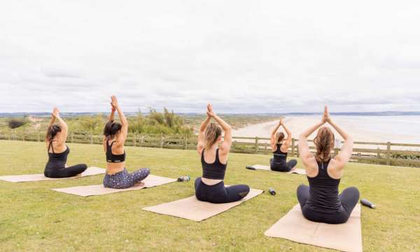 Yoga on the lawn with sea views