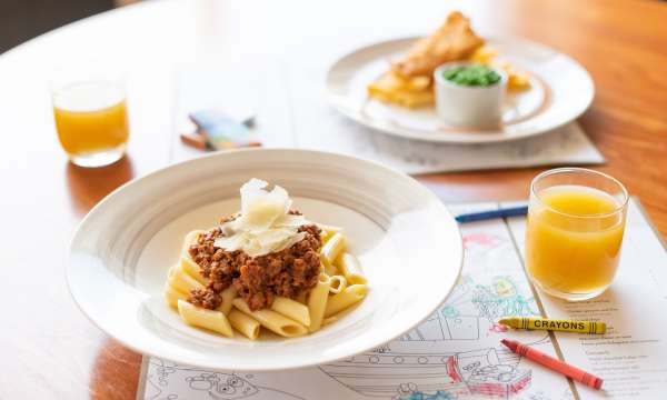 Kids teas dining with crayons and menus