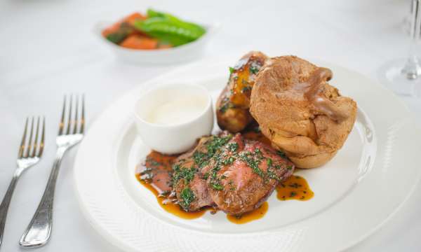 Roast Beef and Yorkshire Pudding on a white plate