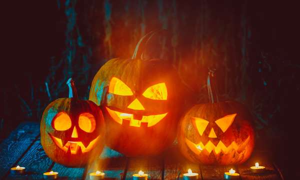 Three Pumpkins carved with faces