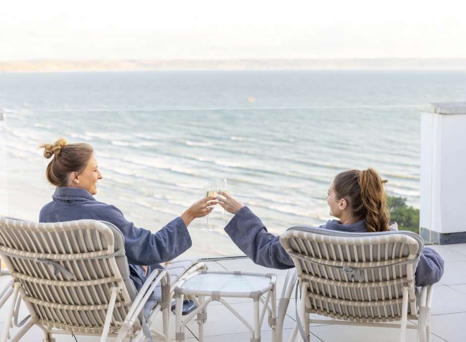 Saunton Sands Hotel Source Spa Guests on Sun Deck Toasting with Champagne Flutes Overlooking the Sea