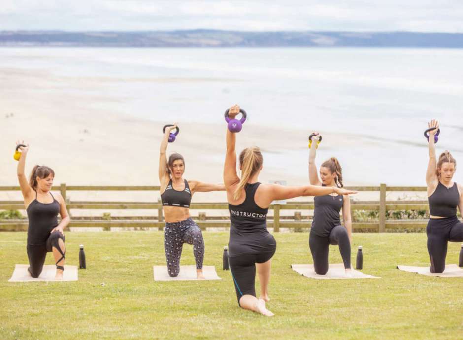 Fitness class on lawn with sea views