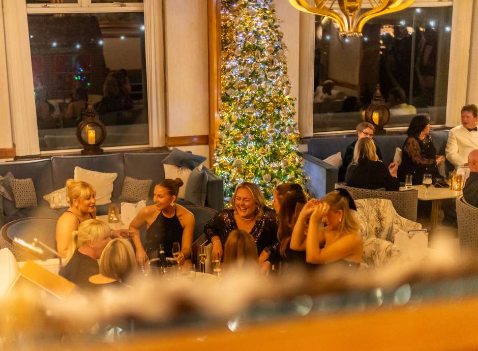 Saunton Sands Hotel, Ladies sat in lounge with Christmas tree