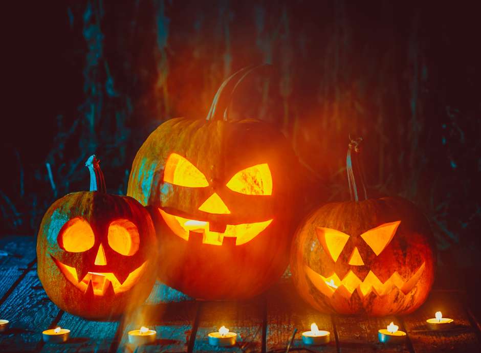 Three Pumpkins carved with faces
