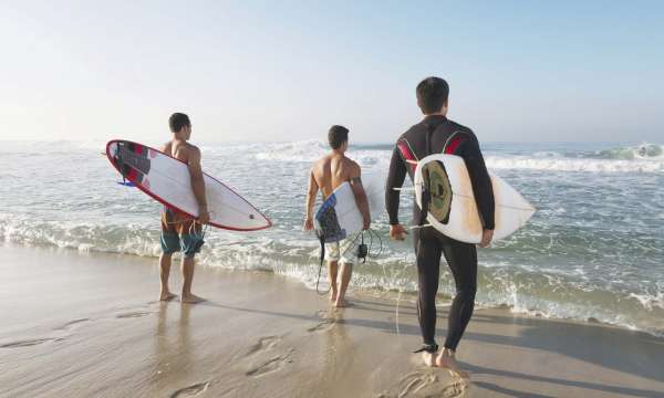 Saunton Sands Hotel Group of Guests With Surfboards on Saunton Beach
