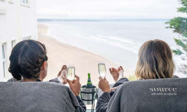 Saunton Sands Hotel Source Spa Guests Enjoying Prosecco in Treatment Room and Looking at View Over Saunton Beach from Window