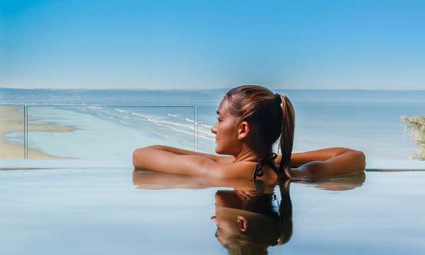 Saunton Sands Hotel Source Spa Guest in Vitality Pool Looking Out on Saunton Beach