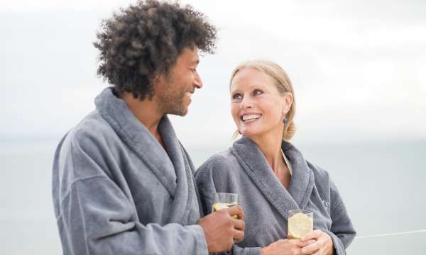 Couple on roof terrace with prosecco