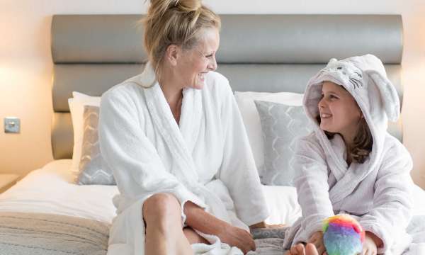 Mother and child on bed