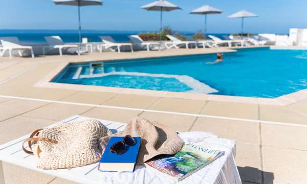 Lady swimming in the outdoor pool