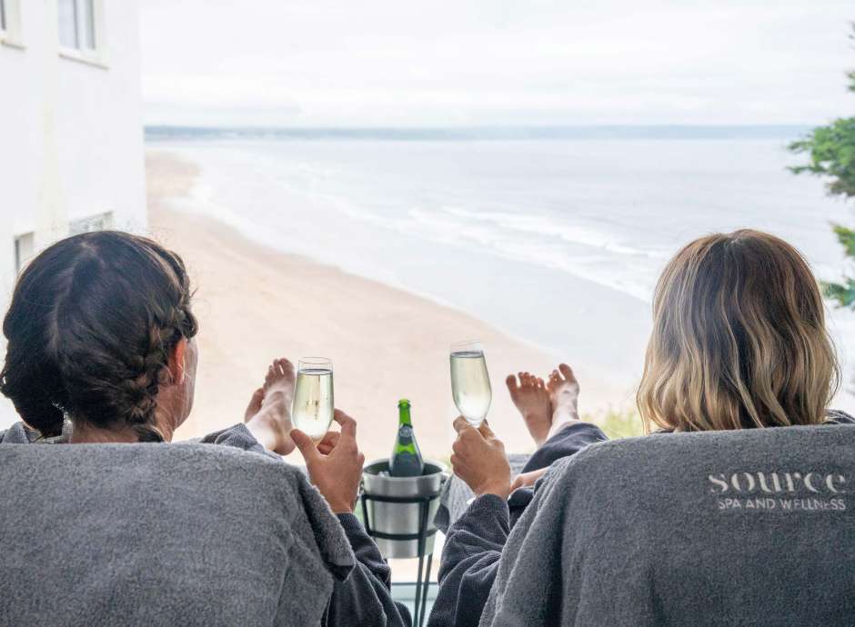 Saunton Sands Hotel Source Spa Guests Enjoying Prosecco in Treatment Room and Looking at View Over Saunton Beach from Window