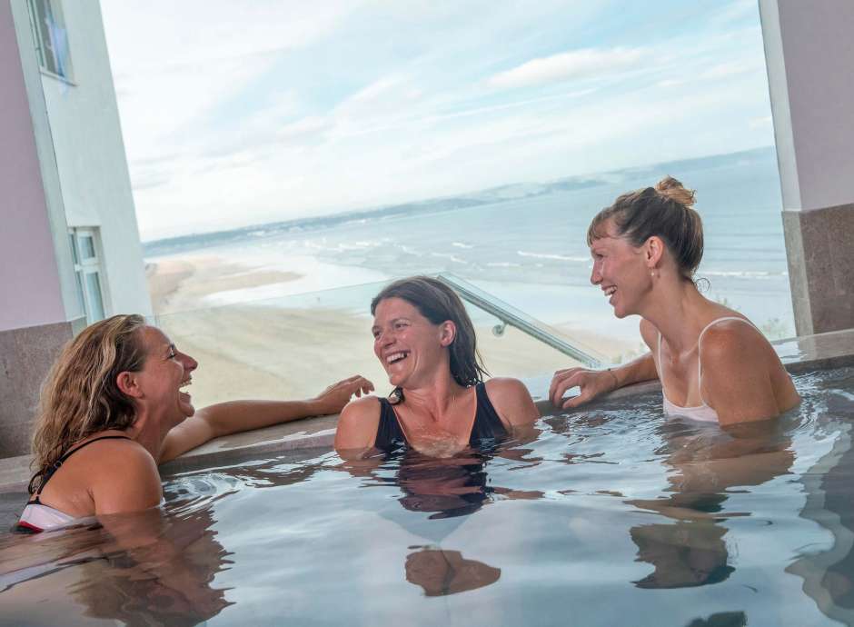Saunton Sands Hotel Source Spa Guests Laughing in Vitality Pool Hot Tub