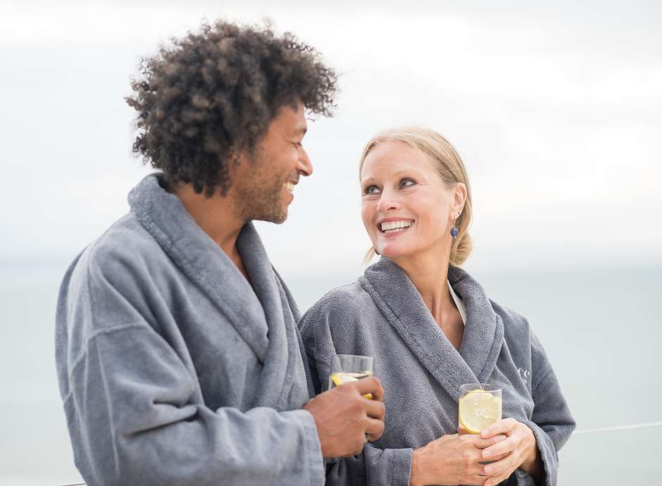 Couple on roof terrace with prosecco