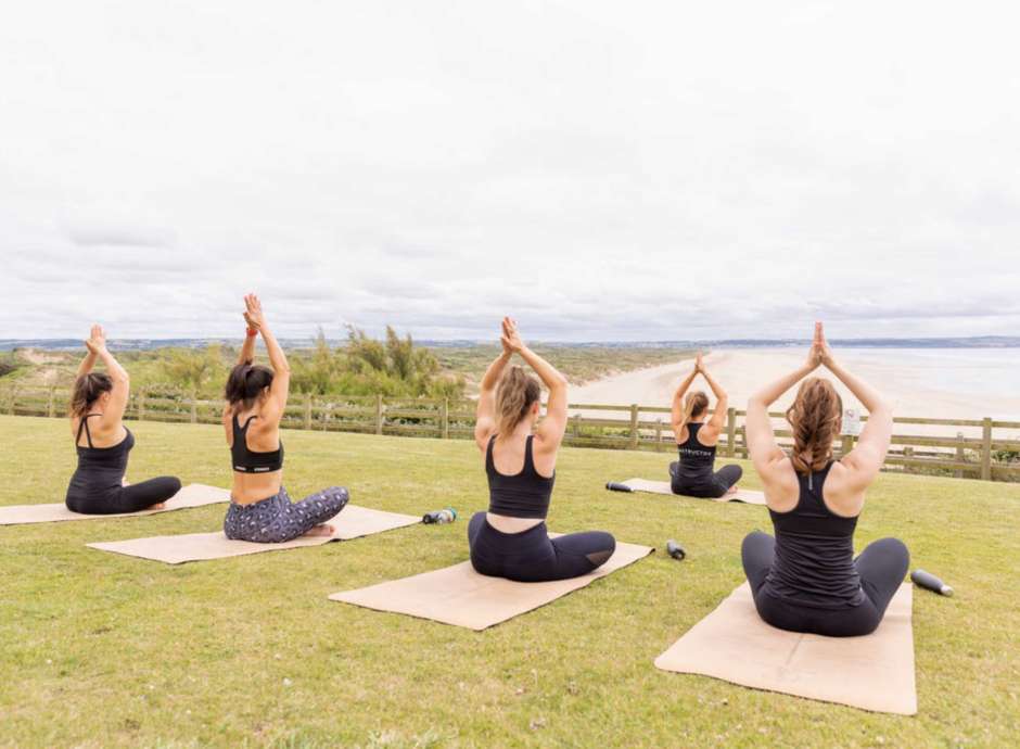 Yoga on the lawn with sea views