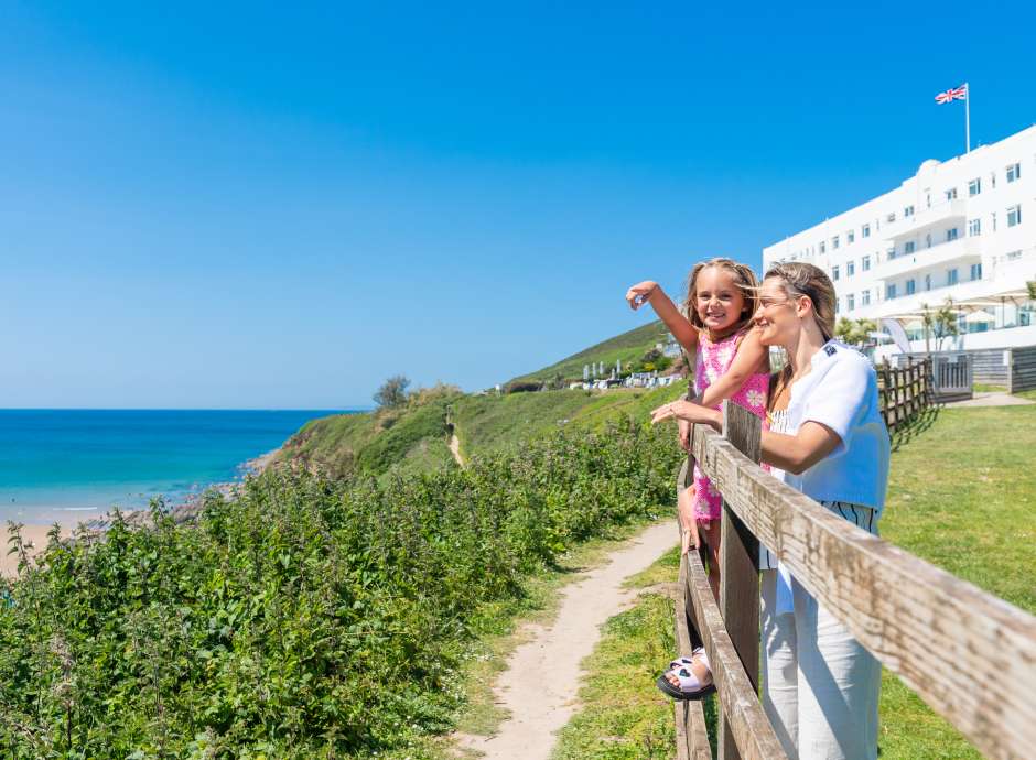 Mum and daughter looking at the view outside 