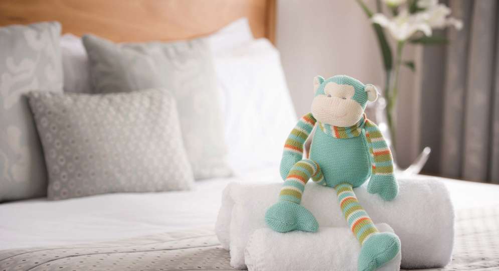 Saunton Sands Hotel Accommodation Bedroom Cuddly Monkey Childs Soft Toy on Bed